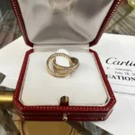 Bague authentique cartier en or trinity et diamants